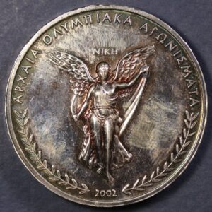 Alternative view of ΑΣΗΜΕΝΙΟ ΜΕΤΑΛΛΙΟ 999/1000 ΟΛΥΜΠΙΑΚΑ ΑΓΩΝΙΣΜΑΤΑ ΤΕΘΡΙΠΠΟΝ ΤΗΣ ΜΑΙΛΙΝΚ GC1143